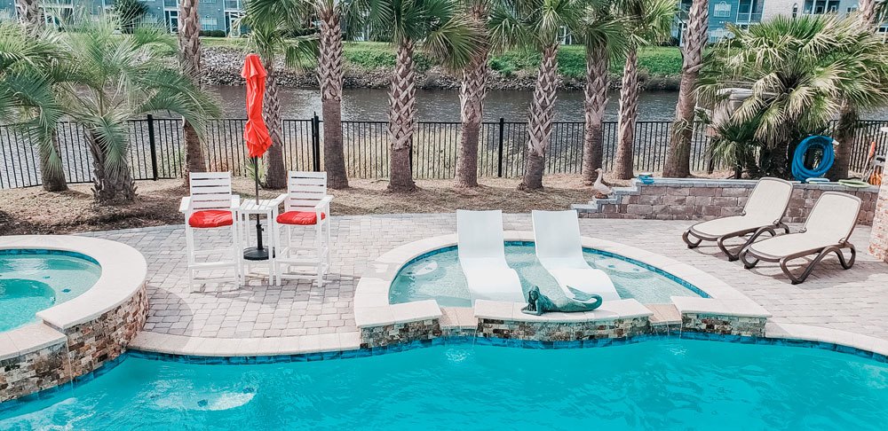 pool installation by a backyard creation